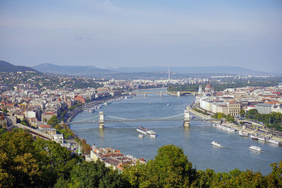 High angle view of river and buildings in city