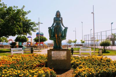 Statue in park against clear sky