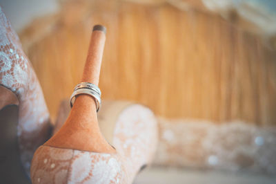 Close-up of wedding rings on high heels