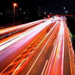 High angle view of light trails on road at night