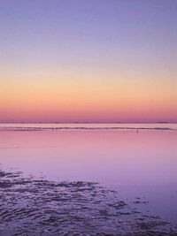 Scenic view of sea against clear sky during sunset