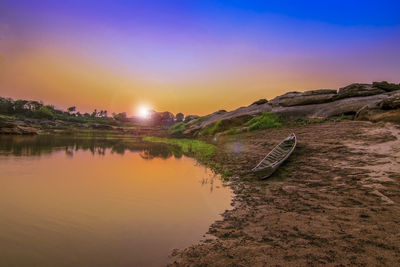 Scenic view of lake against sky during sunset