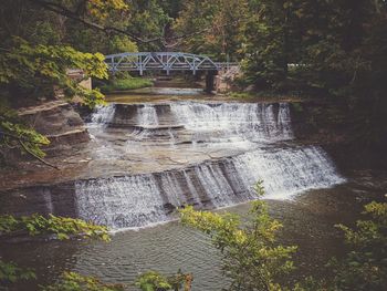 Water flowing on dam in forest