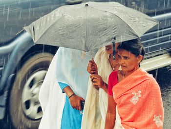 High angle view of woman holding umbrella