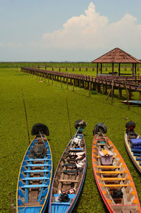 Boats moored at harbor