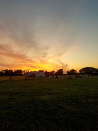 Scenic view of field against sky during sunset