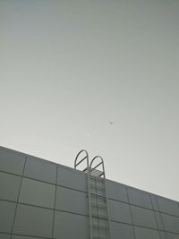 Low angle view of modern building against clear sky