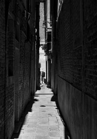 Narrow alley amidst buildings in city