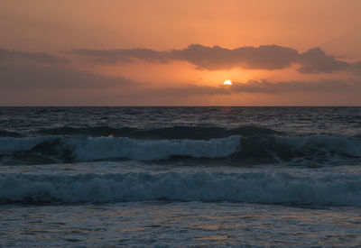 Scenic view of sea at sunset