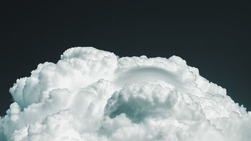 Close-up of clouds over black background