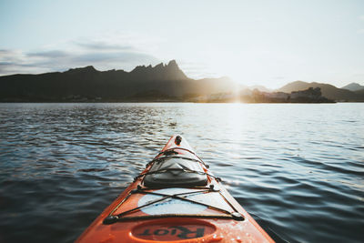 Kayak in lake against sky