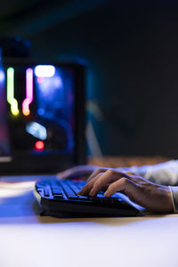Cropped hand using laptop on table