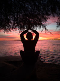 Yoga session at sunset next to the parana river