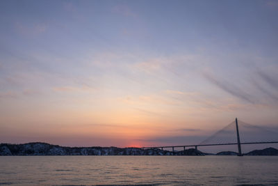 View of suspension bridge at sunset