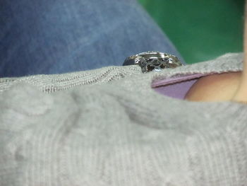 Close-up of woman hand on fabric