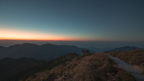 Scenic view of mountains against sky during sunset