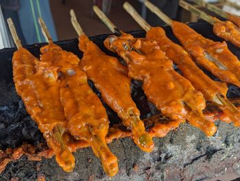 High angle view of meat on barbecue