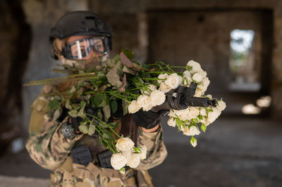 Portrait of soldier shooting through gun