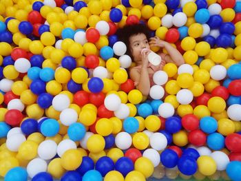 High angle view of boy playing with ball