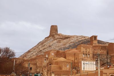 Low angle view of old building against sky anarak history iran