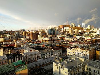 High angle view of buildings in city against sky