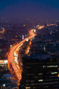 High angle view of illuminated cityscape at night