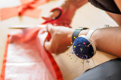 Close-up of dressmaker working