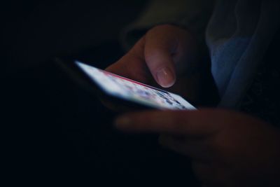 Close-up of man using smart phone