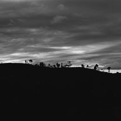 Scenic view of landscape against cloudy sky