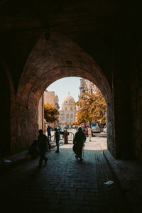 People walking in tunnel