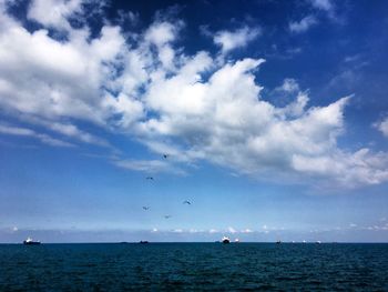 Scenic view of sea against blue sky