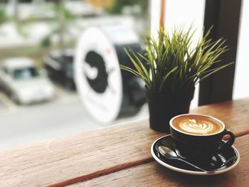 Close-up of coffee cup on table