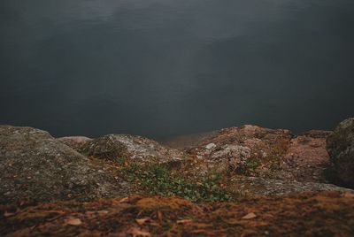 Close-up of rock against sky