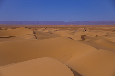 Scenic view of desert against clear sky