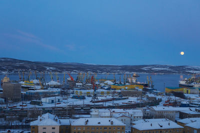 High angle view of buildings in city against sky during winter