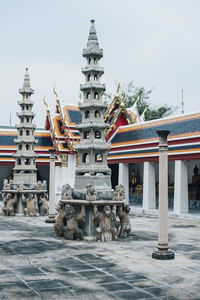 Statue of temple against building