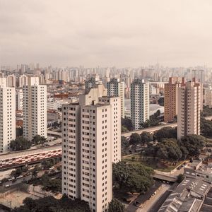 High angle view of buildings in city against sky