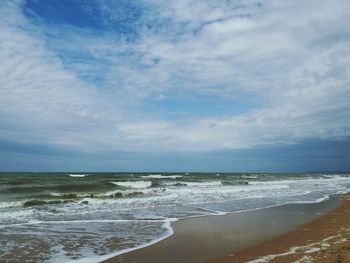 Scenic view of beach against sky