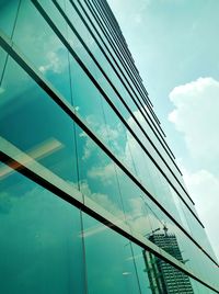 Low angle view of modern building against blue sky