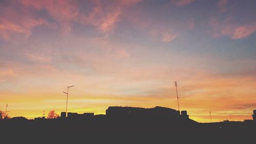 Silhouette of built structure at sunset