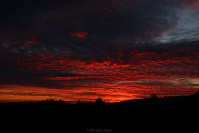 Scenic view of dramatic sky during sunset