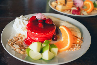 Close-up of breakfast served in plate on table