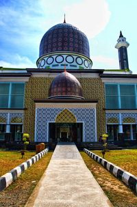 Facade of temple building against sky