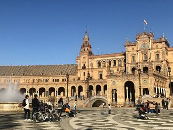 Group of people in front of historical building