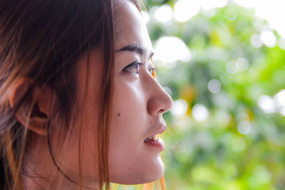 Close-up portrait of smiling young woman