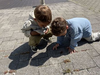 High angle view of boys on footpath