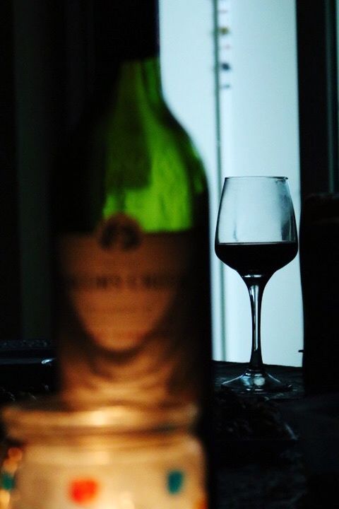 CLOSE-UP OF BEER BOTTLES ON TABLE