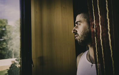 Portrait of young man looking away