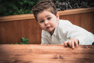 Portrait of cute boy on table