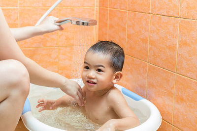 Cute boy in bathroom at home